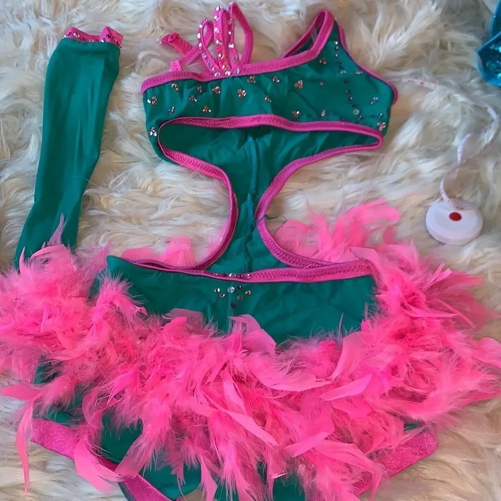Custom dance costume with Swarovski Crystals. Teal and pink with arm sleeves